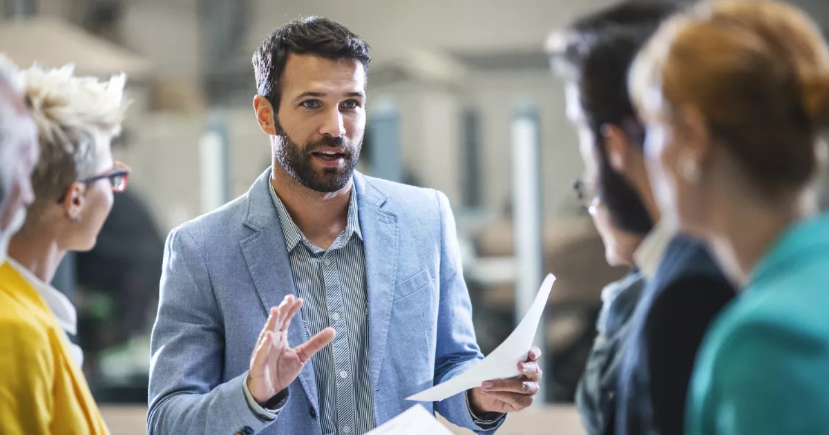 A professional studying an AIM Microcredential online on a laptop